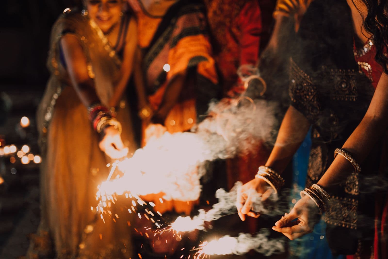 People holding sparklers at a Festival of Lights celebration